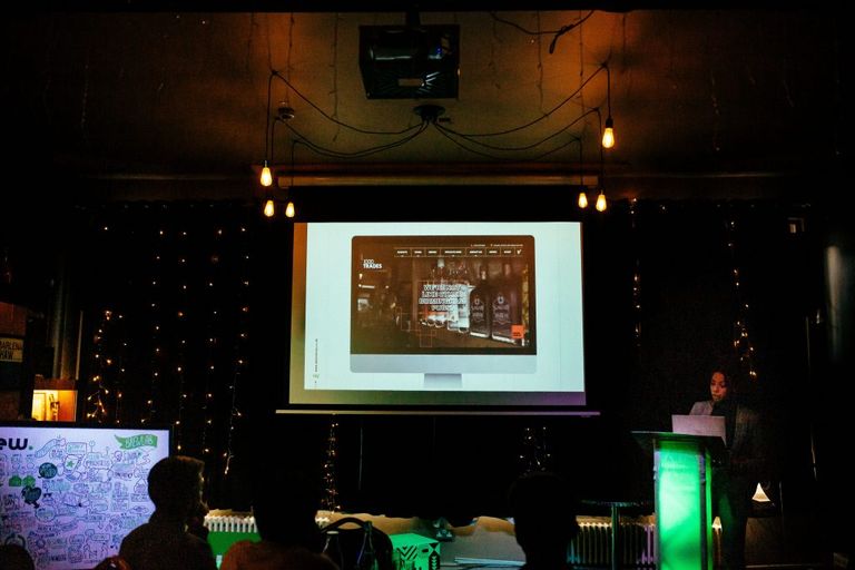 Female speaker behind a lectern giving a talk