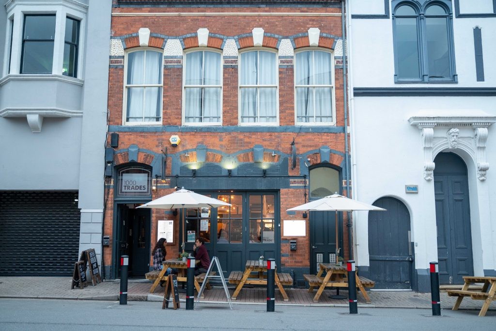 Two customers sat outside of 1000 trades on benches