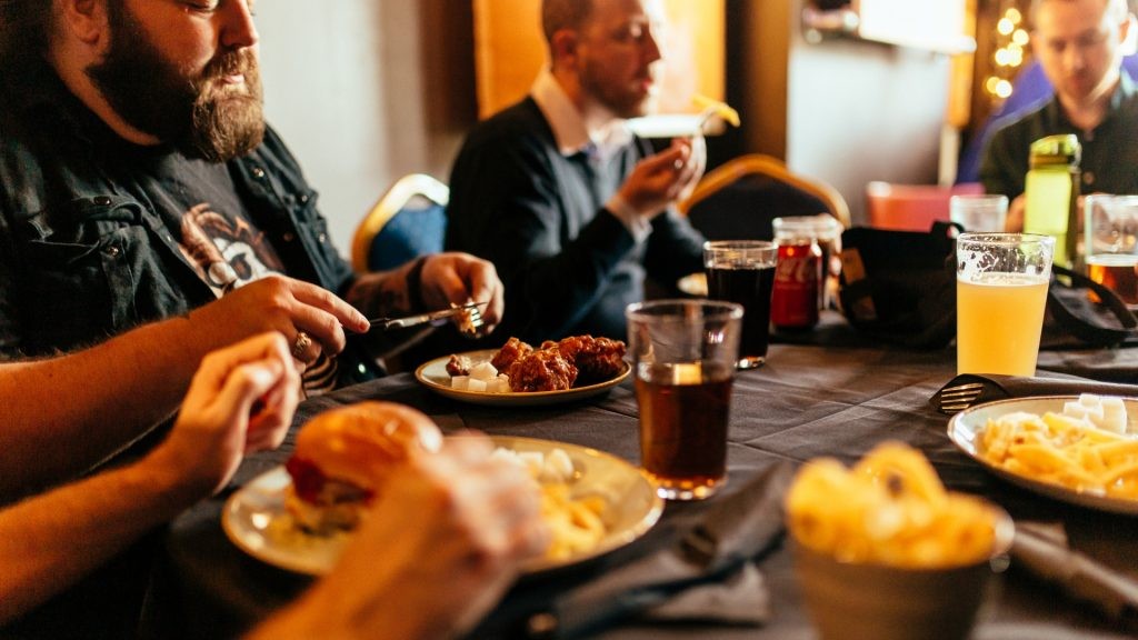 Group eating dinner at 1000 Trades
